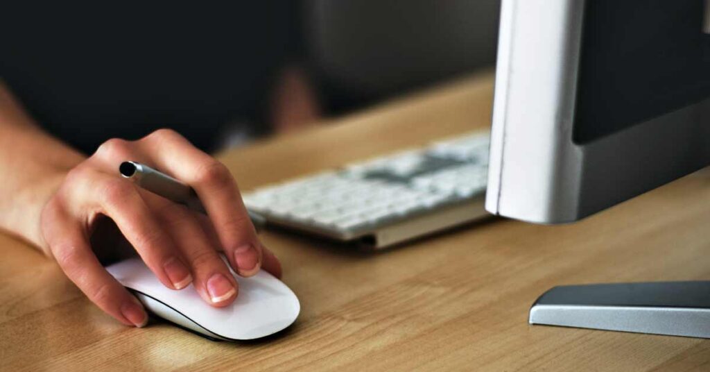 Hand clicking on mouse button