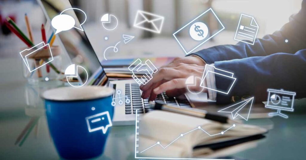 Hands typing on keyword with different icons floating around