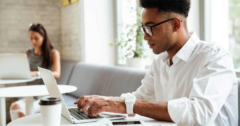 Man typing on keyboard