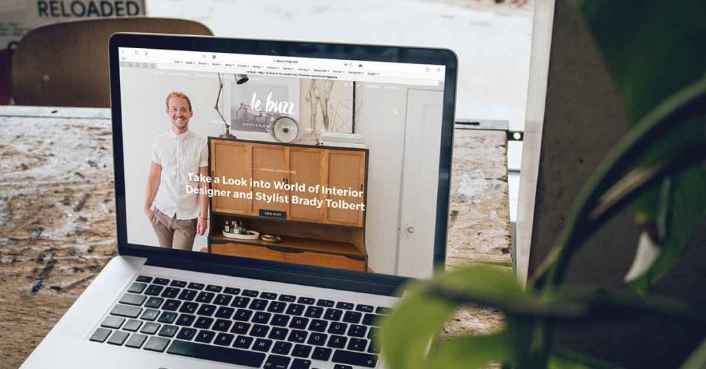 Laptop on counter with website landing page displayed